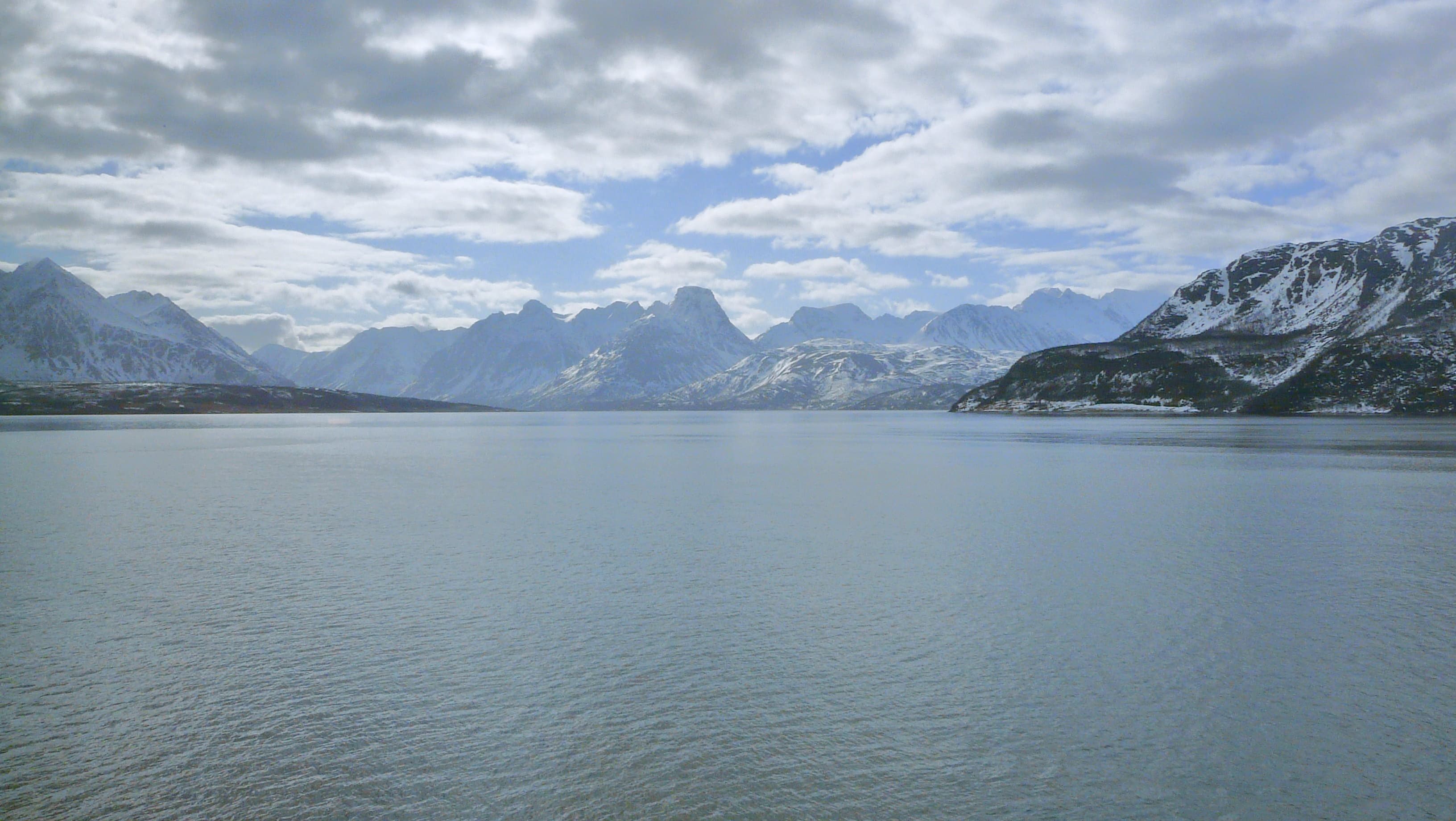 A view to Ullsfjorden towards south as seen from a ferry crossing the fjord from Breivikeidet to Svensby. Picture has been taken in 2009 May.