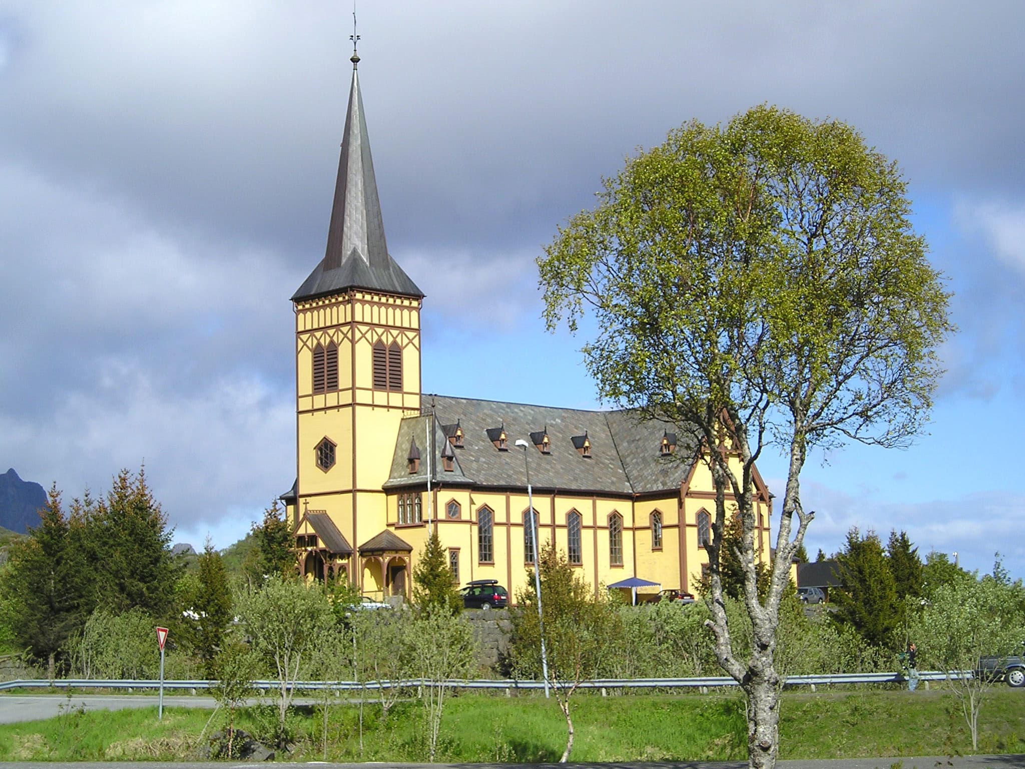This file is lacking author information. · CC BY 2.5 Vågan Church (Lofoten Cathedral) in Kabelvåg, Nordland in Norway from 1898. Wooden church in Gothic revival style. Architect Carl Julius Bergstrøm. Vågan kirke, Lofotkatedralen, i Kabelvåg i Nordland. Korskirke i tre i nygotikk. Innviet 1898. Arkitekt Carl Julius Bergstrøm. This is a photo of a monument in Norway, number: 85878 in the Norwegian Directorate for Cultural Heritage database.